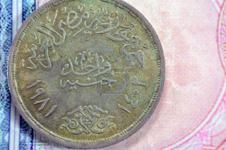 Photo for One Egyptian pound 1 LE EGP commemorative coin, Ahmed Orabi's 100th Anniversary Revolution 1881 AD, series 1981 AD 1402 AH, revolt man on a horse with followers on a side, value and date on other side - Royalty Free Image