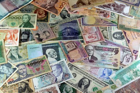 Photo for Various old cash money banknotes from different countries of the world, stack of multiple currencies, pile of vintage retro bills of different origins with profiles of country leaders, ancient money - Royalty Free Image
