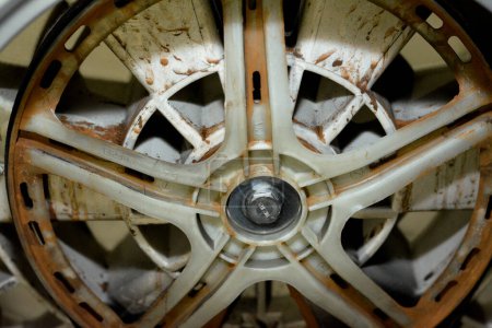 Photo for Rusty old dirty automatic electric washing machine drum that is connected to the machine motor engine, washing machine maintenance, fixing machine and replacement concept, selective focus - Royalty Free Image
