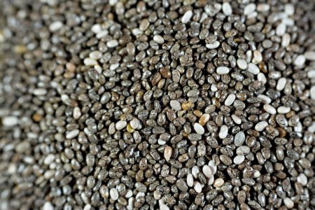 Photo for Dried chia seeds with a high content of dietary fiber, vitamins, minerals, protein, fat and carbohydrates, rich in B vitamins, thiamin and niacin, it's edible seeds of Salvia hispanica of mint family - Royalty Free Image