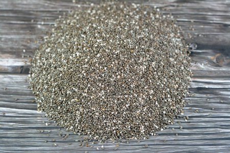 Photo for Dried chia seeds with a high content of dietary fiber, vitamins, minerals, protein, fat and carbohydrates, rich in B vitamins, thiamin and niacin, it's edible seeds of Salvia hispanica of mint family - Royalty Free Image
