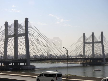 Photo for Cairo, Egypt, March 9 2023: The Rod El Farag Axis Tahya Misr Masr Bridge, the world's widest cable-stayed bridge according to the Guinness World Record, built by the Arab contractors Osman Ahmad Osman - Royalty Free Image