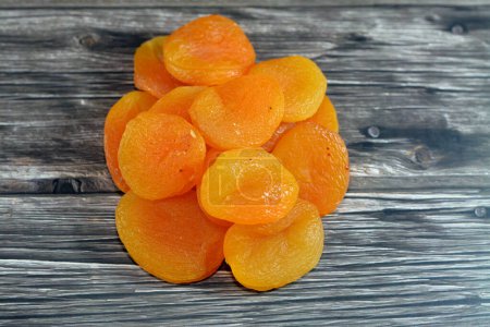 Photo for Dried apricots dehydrated fruit, usually used as a snack, also cooked in sweets and used in Ramadan month as Yamesh in Khoshaf compote, rich in important nutrients, including fiber, potassium, iron - Royalty Free Image