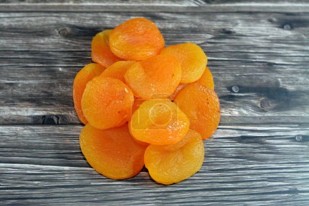 Photo for Dried apricots dehydrated fruit, usually used as a snack, also cooked in sweets and used in Ramadan month as Yamesh in Khoshaf compote, rich in important nutrients, including fiber, potassium, iron - Royalty Free Image