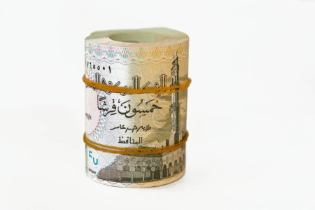 Photo for 50 Piasters Half EGP LE Egyptian pound cash money bills rolled up with rubber bands with a image of Al Azhar mosque and Ramesses II the second 2nd, Egypt money bundle roll of 50 piastres - Royalty Free Image