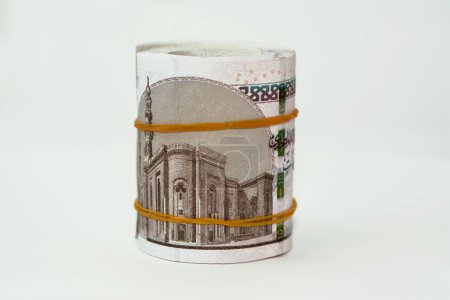 Photo for 10 EGP LE ten Egyptian pounds cash money bills rolled up with rubber bands with a image of Al Rifa'i the royal mosque and khafre enthroned, Egypt money bundle roll, selective focus - Royalty Free Image