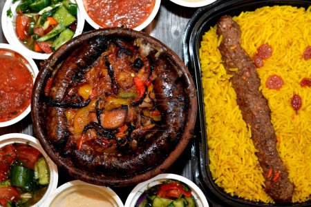 Photo for Traditional Egypt beef  Kofta, kebab and tarb kofta shish with mixture of lamb meat, sausage mumbar intestines filled with rice, kawareh trotters cow feet, pieces of cooked kidneys, heart, testicles - Royalty Free Image