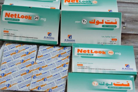 Photo for Cairo, Egypt, May 2 2023: NetLook soft gelatin capsules, Isotretinoin is an oral prescription medication that affects sebaceous glands and is used to treat severe acne vulgaris skin disease - Royalty Free Image