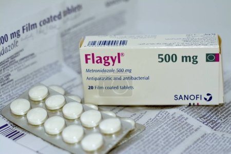Photo for Cairo, Egypt, May 4 2023: Flagyl metronidazole 500mg tablets,  Amebicides, an antibiotic that is used to treat bacterial infections of the vagina, stomach, liver, skin, joints, brain and spinal cord - Royalty Free Image