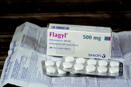 Photo for Cairo, Egypt, May 4 2023: Flagyl metronidazole 500mg tablets,  Amebicides, an antibiotic that is used to treat bacterial infections of the vagina, stomach, liver, skin, joints, brain and spinal cord - Royalty Free Image