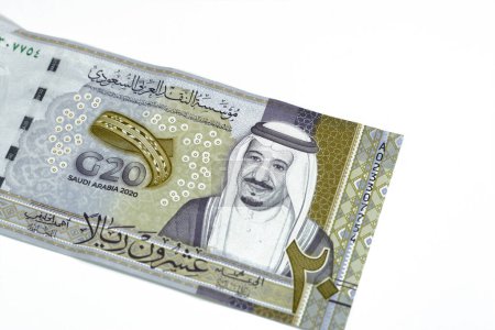 Photo for Obverse side of 20 SAR twenty Saudi Arabia Riyals banknote currency bill money Commemorative issue with portrait of king Salman , 3D logo of the Kingdom's Presidency of G20 summit in 2020 AD 1442 AH - Royalty Free Image