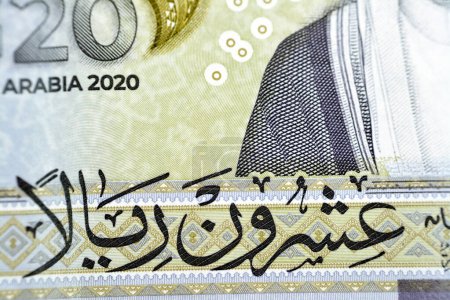 Photo for Translation of Arabic (Twenty Riyals) from bverse side of 20 SAR twenty Saudi Arabia Riyals banknote currency bill money Commemorative issue with 3D logo of the Kingdom's Presidency of G20 summit - Royalty Free Image