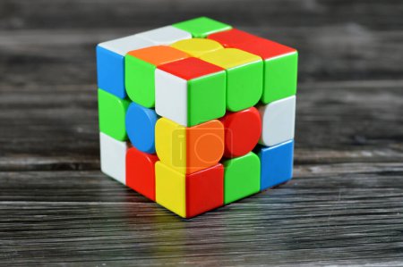 Photo for The Rubik's Cube, combination puzzle, speed magic puzzle cube, each of the six faces was covered by nine stickers, each of one of six solid colors: white, red, blue, orange, green, and yellow - Royalty Free Image