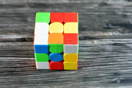Photo for The Rubik's Cube, combination puzzle, speed magic puzzle cube, each of the six faces was covered by nine stickers, each of one of six solid colors: white, red, blue, orange, green, and yellow - Royalty Free Image