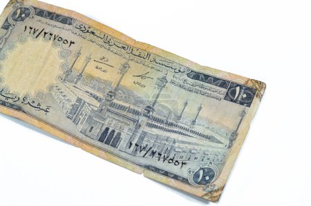 Photo for Obverse side of 10 SAR Saudi Arabia riyals cash money currency banknote features Al-Masjid al-Haram (Holy mosque), Mecca, vintage retro old 10 riyals, selective focus - Royalty Free Image