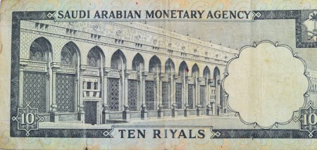 Photo for Large fragment of the reverse side of 10 SAR Saudi Arabia riyals cash money currency banknote features Al-Masa Wall with arch at Al-Masjid al-Haram (Holy mosque), Mecca, vintage retro old 10 riyals - Royalty Free Image
