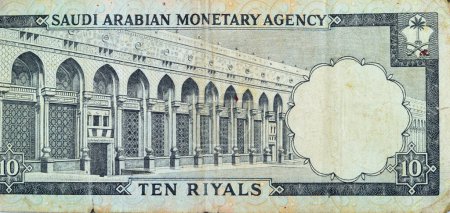 Photo for Large fragment of the reverse side of 10 SAR Saudi Arabia riyals cash money currency banknote features Al-Masa Wall with arch at Al-Masjid al-Haram (Holy mosque), Mecca, vintage retro old 10 riyals - Royalty Free Image