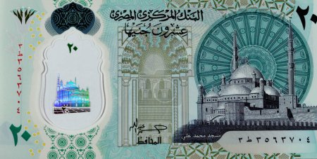 Photo for Large fragment of the obverse side of the new Egyptian 20 EGP LE twenty polymer pounds cash money banknote bill features Mohamed Ali Mosque and adorned with tactile ADA Braille dots along - Royalty Free Image