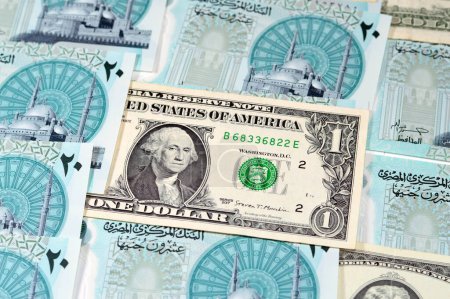 Photo for Background of USD American dollars money bills with the new Egyptian 20 EGP LE twenty polymer pounds cash money banknote bill features Mohamed Ali Mosque, American and Egyptian currency exchange rate - Royalty Free Image