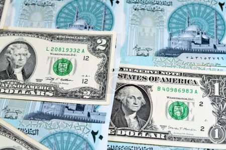Photo for Background of USD American dollars money bills with the new Egyptian 20 EGP LE twenty polymer pounds cash money banknote bill features Mohamed Ali Mosque, American and Egyptian currency exchange rate - Royalty Free Image