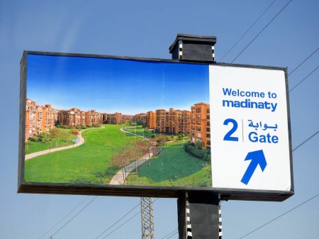 Photo for Cairo, Egypt, June 30 2023: Signboard for direction of Madinaty My City , an 8000 acre real estate development project, in the New Cairo satellite city by Talaat Mostafa Group Holding company - Royalty Free Image