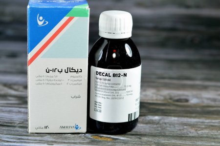 Photo for Cairo, Egypt, June 26 2023: DECAL B12 N SYRUP 120 ML, For prevention and treatment of calcium, vitamin D and vitamin B12 deficiency, for delayed convalescence, asthenia and debility by AMRIYA CO - Royalty Free Image