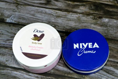 Photo for Giza, Egypt, July 21 2023: skin care creams of Nivea and Dove, Nivea is a German personal care brand Beiersdorf Global AG and dove is Dove is a personal care brand owned by  Unilever, selective focus - Royalty Free Image