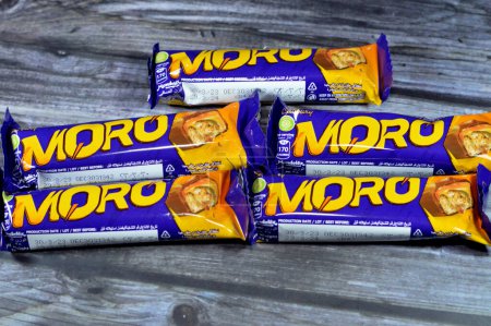 Photo for Cairo, Egypt, July 29 2023: Cadbury Moro Chocolate caramel bar, a delicious fusion of crunchy peanuts, sweet caramel, and a creamy center all coated in smooth milk chocolate, selective focus - Royalty Free Image