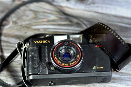 Photo for Giza, Egypt, August 12 2023: Yashica MF 2 Super reusable film camera for 35mm film, build in flash, automatic DX, low light warning, 38mm lens - 3 element, 3 group lens composite, vintage retro, old - Royalty Free Image