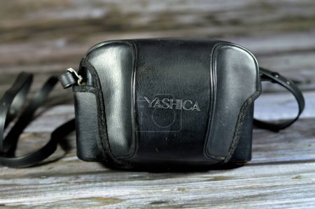 Photo for Giza, Egypt, August 12 2023: Yashica MF 2 Super reusable film camera for 35mm film, build in flash, automatic DX, low light warning, 38mm lens - 3 element, 3 group lens composite, vintage retro, old - Royalty Free Image