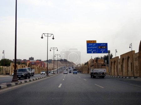 Photo for Cairo, Egypt, September 30 2023:  Gehan Al Sadat axis highway road, previously Al Firdous highway or The Paradise axis, Mrs. Jehan Sadat is the wife of president Anwar Al Saddat of Egypt - Royalty Free Image
