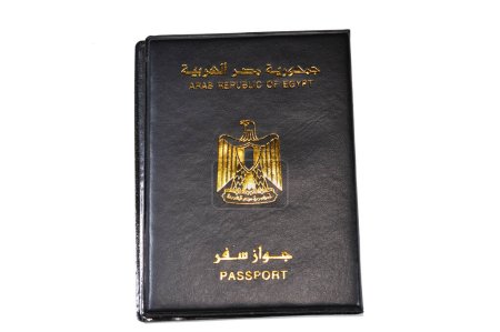 Photo for Egyptian passport black book, Translation of Arabic words (Arab republic of Egypt's passport) with the republican golden eagle on its cover, A black passport cover to protect the passport ID - Royalty Free Image