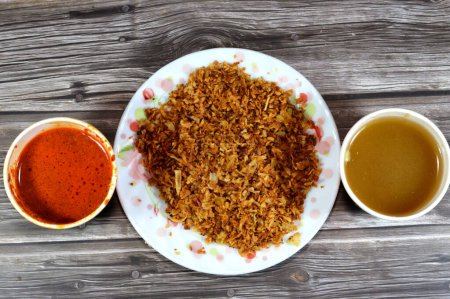 Fried onions, spices and peppers sauce called Shatta and Cumin vinegar sauce, Also called Dakkah sauce, made of white vinegar, ground cumin, crushed garlic, very popular in Egypt for Koshary cuisine