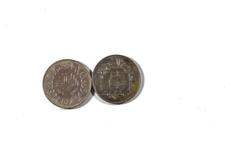 Old Egyptian silver coins of 50 piasters of president Gamal Abdel Nasser of Egypt, 10 piasters of king Farouk I of Egypt and Sudan, vintage retro old Egyptian silver coins, selective focus