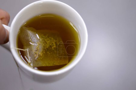 Anise hot drink, with so many healthy benefits, anise packet in a boiled hot water to prepare the drink, Aniseed Pimpinella anisum is a flowering plant in the family Apiaceae, selective focus