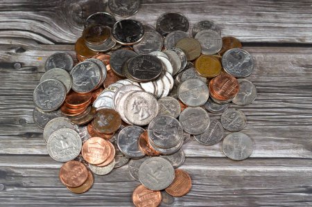 Pile of American coins of 1 cent, 5, 10, 25 cents quarter and one dollar, Vintage retro old American money background, United States of America dollars change coins, United States of America change
