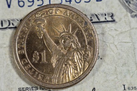 The Statue of Liberty on the reverse side of one American commemorative issue presidential series coin with Martin Van Buren 8th President of United States of America on obverse side, on old USD