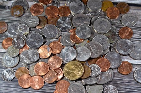 Pile of American coins of 1 cent, 5, 10, 25 cents quarter and one dollar, Vintage retro old American money background, United States of America dollars change coins, United States of America change