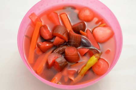 marinated vegetables (Torshi) or mixed pickled vegetables of sliced cucumbers, carrots, beets, turnips, onions, red peppers and salt, Egyptian appetizer Arabian cuisine, selective focus