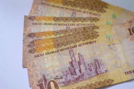 Photo for Saudi Arabia 10 SAR ten Saudi riyals cash money banknote with the photo of king Abdullah Bin AbdulAziz Al Saud, Murabba palace and King AbdulAziz Financial District in Al Aqeeq area of Riyadh - Royalty Free Image