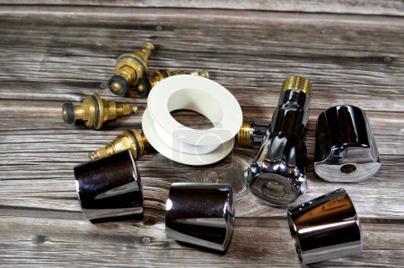 plumbing and maintenance concept background at home, faucet body cartridge parts, changing faucets and taps home issues, replacement an old parts with new ones, home service maintenance concept