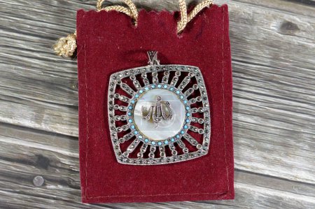 Translation of the Arabic Text (Allah, God) on a silver precious metal piece with precious stones, exchange rate marketing and value, business, price of silver concept, an investment, store of value