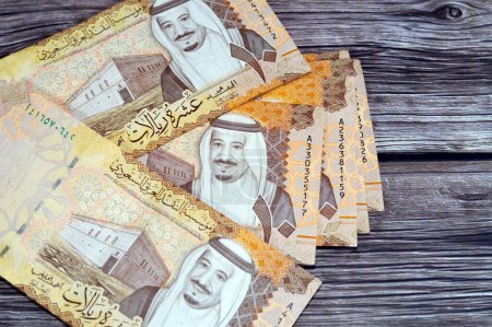 Saudi Arabia 10 SAR ten Saudi riyals cash money banknote with the photo of king Abdullah Bin AbdulAziz Al Saud, Murabba palace and King AbdulAziz Financial District in Al Aqeeq area of Riyadh