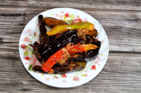 Pickled roast fried aubergine and green peppers stuffed with garlic, chili red pepper,vinegar, lemon, coriander, parsley, chopped tomatoes and spices, marinated Egyptian eggplant pickles