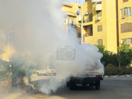 Photo for Cairo, Egypt, May 16 2024: a stainless steel mosquito fogger machine on a vehicle, fogger is any device that creates a fog, typically containing an insecticide for killing insects and other arthropods - Royalty Free Image