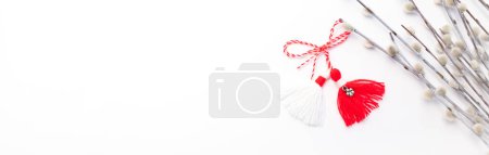 Photo for Banner Martenitsa, Baba Marta. Traditional Martisor Symbol of Holiday March 1 on White Background With Willow Twig.Grandma Marta Day Celebration In Romania,Bulgaria,Moldova. Red,white colored threads. - Royalty Free Image