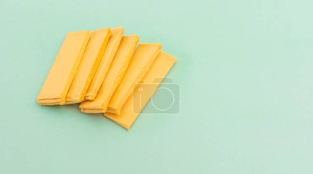 Photo for Bio Pop Up Kitchen Dish Sponge, Cellulose Compressed Sponge on Green Background, Eco Natural Product for Cleaning, Sanitation. Mockup, Copy Space for Text. Horizontal Plane, Design. - Royalty Free Image
