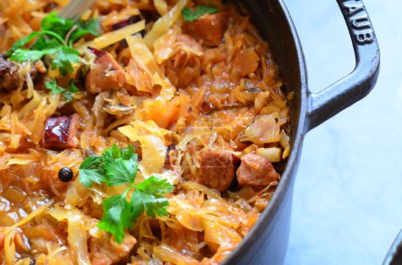 Photo for Traditional Polish cabbage soup ,,Bigos'' with sauerkraut, bacon and mushrooms - Royalty Free Image