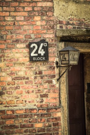 old brick wall with number 24, concentration camp auschwitz au au, poland