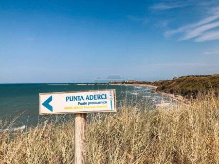 Photo for A sign indicating Punta Aderci panoramic view point with the italian sea. Punta Aderci nature reserve, Vasto, Chieti, Italy - Royalty Free Image